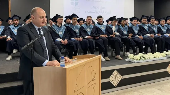The VTP Director delivers a speech during the graduation ceremony, addressing trainees and highlighting their achievements and the importance of vocational training in strengthening skills and opportunities. Photo: LWF Jerusalem